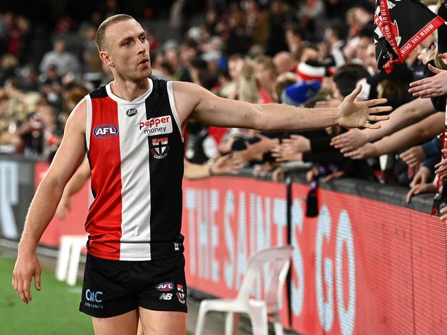 MELBOURNE, AUSTRALIA - MAY 14: Callum Wilkie of the Saints high fives fans after winning the round nine AFL match between the St Kilda Saints and the Geelong Cats at Marvel Stadium on May 14, 2022 in Melbourne, Australia. (Photo by Quinn Rooney/Getty Images)