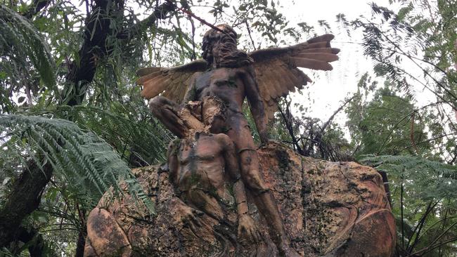 An Aboriginal sculptures in Victoria’s Dandenong Ranges damaged during the recent floods.