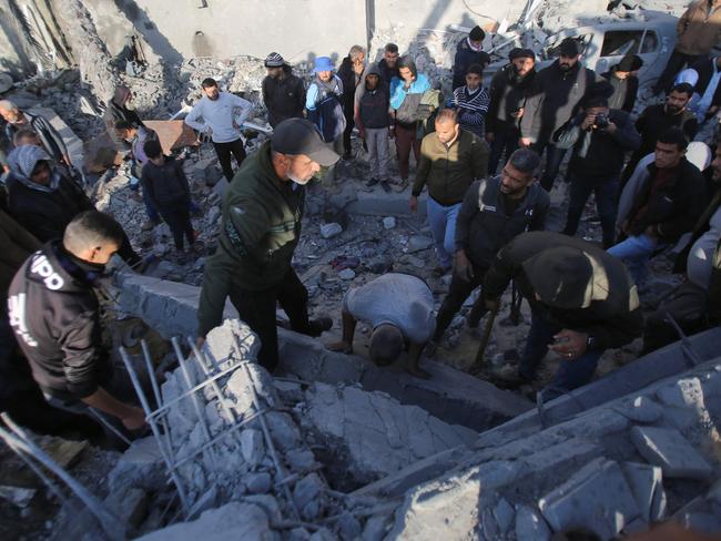 People search for survivors at the site of an Israeli strike that targeted the Abu Samra family home in Deir el-Balah in the central Gaza Strip on. Picture: AFP