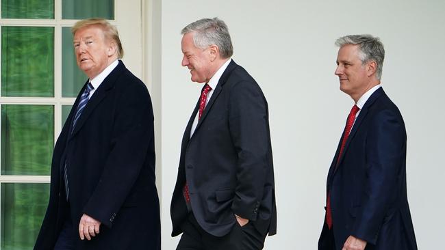 US President Donald Trump walks with Chief of Staff Mark Meadows and US National Security adviser Robert O'Brien. Picture: AFP