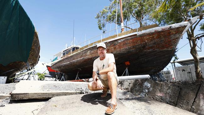 Mike Smith in front of the Stephen Davies on the banks of Trinity Inlet in November, 2022. Picture: Brendan Radke