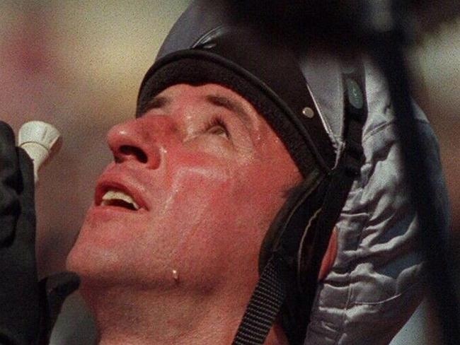 PIRATE: 04/11/1997. Jockey Jim Cassidy sheds a tear as he says a thank you prayer after winning the Melbourne Cup on 'Might and Power'. Flemington. horseracing.