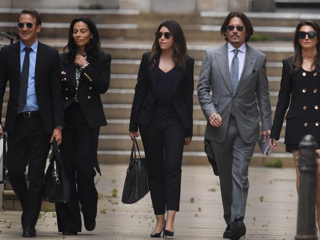 US actor Johnny Depp leaves with members of his team including lawyer Adam Waldman (L) after day eight of his libel trial at the High Court in London, on July 16, 2020. Picture: AFP