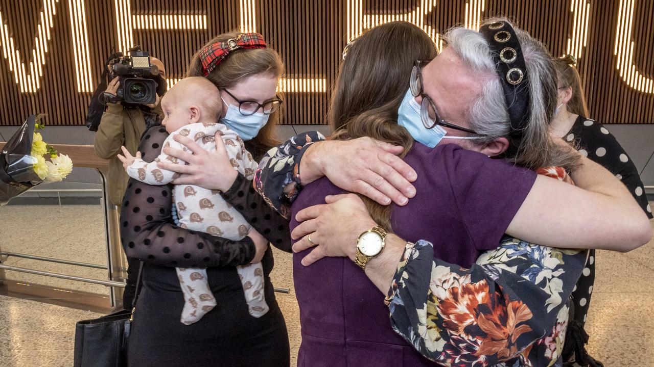 Relatives are reunited after a flight from Wellington, NZ lands at Melbourne Airport. Picture: Jake Nowakowski.