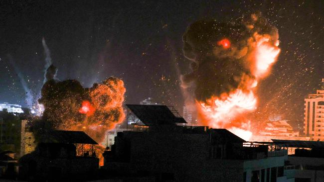 Explosions light up the sky above Gaza City as Israeli forces shell the Palestinian enclave on Monday night. Picture: AFP