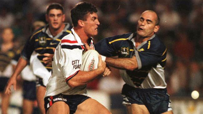 Dale Shearer attempts to stop Rooster Nigel Gaffey in 1998.