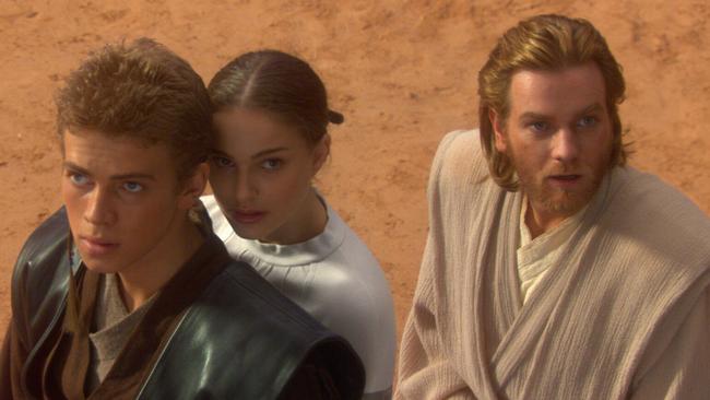 Star Wars : Episode II Attack of the Clones Anakin Skywalker (actor Hayden Christensen), Padme Amidala (actress Natalie Portman) and Obi-Wan Kenobi (actor Ewan McGregor) in the arena of death on the red-rock planet Geonosis - movies scene 2002 headshot film