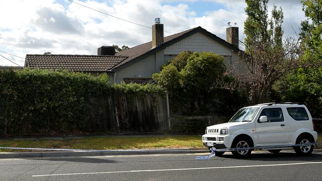 A car taped off in Omama Rd, Murrumbeena, where the couple were killed. Photo: Nicole Garmston