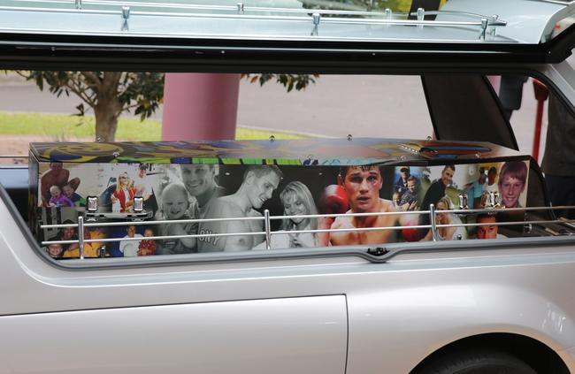 Water’s coffin covered in photos. Picture: AAP Image/Mark Scott