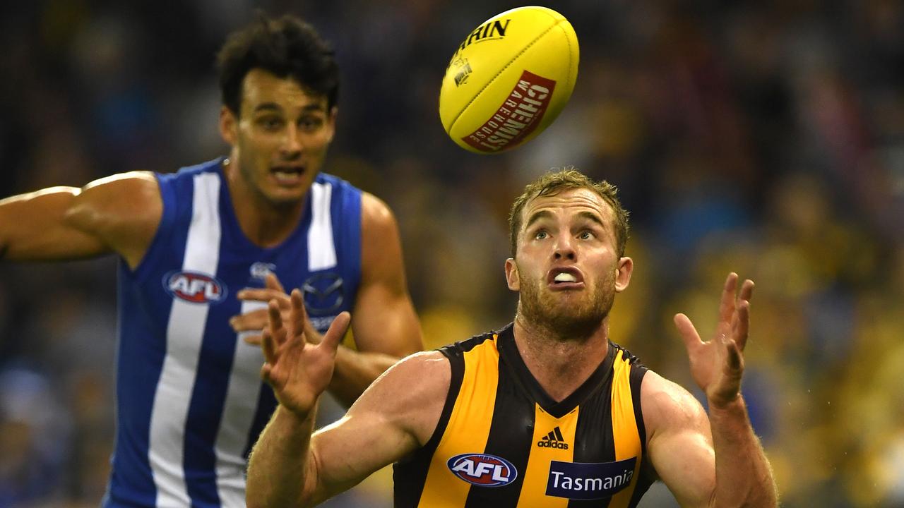 Tom Mitchell of the Hawks (right) is seen in action during the Round 5 AFL match between the North Melbourne Kangaroos and the Hawthorn Hawks at Etihad Stadium in Melbourne, Sunday, April 22, 2018. (AAP Image/Julian Smith) NO ARCHIVING, EDITORIAL USE ONLY