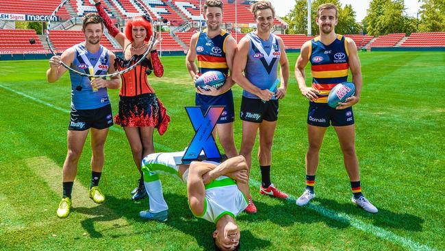 X-TRAVAGANZA: Port Adelaide’s Sam Gray and Karl Amon and Adelaide’s Rory Atkins and Jordan Galucci with entertainers promoting the new AFLX tournament at Hindmarsh Stadium. Picture: Roy Vandervegt (AAP).