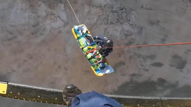 A video released by Lifeflight shows one of two paragliders being winched from a cliff slide following a collision. Photo: contributed