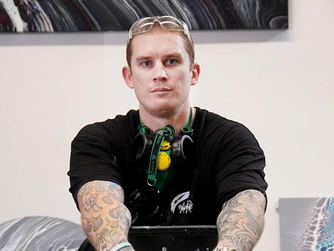 Former Collingwood Magpies AFL footballer Dayne Beams poses in his Bayswater art workshop in Melbourne, Wednesday, April 1, 2020. Beams is now a successful artist and mental health advocate after recently retiring from the AFL and is also training to be a mental health counsellor. (AAP Image/Michael Dodge) NO ARCHIVING