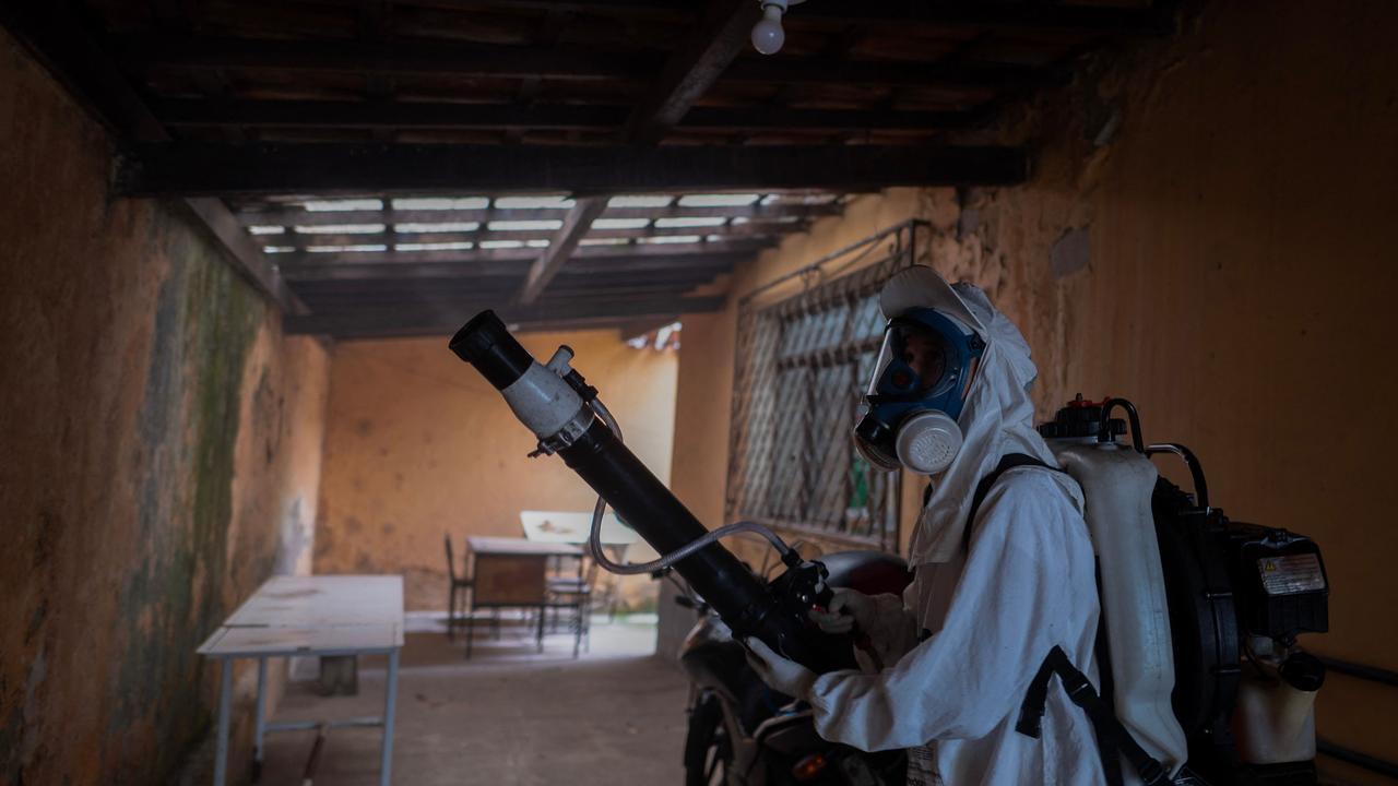 A health worker fumigates against mosquitoes carrying dengue, Zika, and Chikungunya viruses in Brazil. Picture: Douglas Magno/AFP