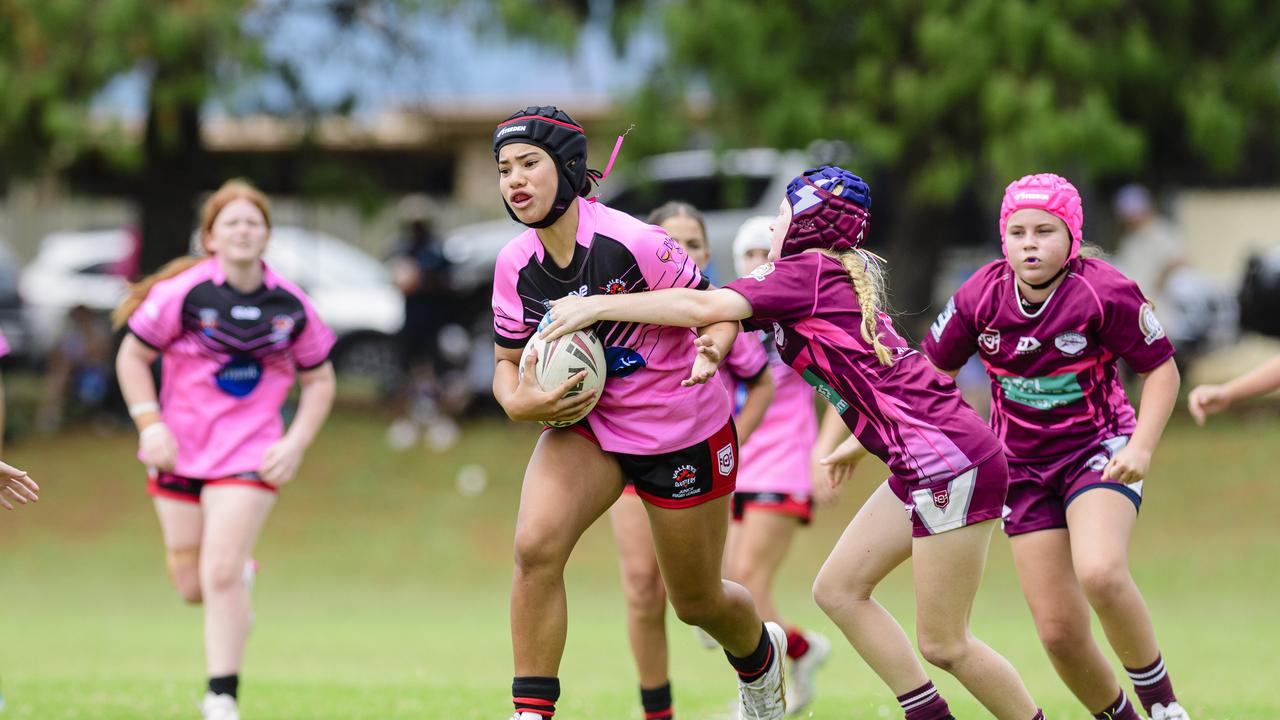 Charlotte Jones tries to break free of a tackle. Picture: Kevin Farmer