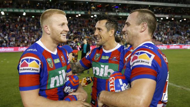 Mitchell Barnett, Mitchell Pearce and Jamie Buhrer of the Knights enjoy their win after the Round 5 NRL match between the Newcastle Knights and the Brisbane Broncos at McDonald Jones Stadium in Newcastle, Saturday, April 7, 2018. (AAP Image/Darren Pateman) NO ARCHIVING, EDITORIAL USE ONLY