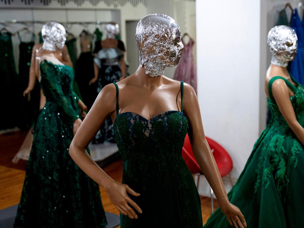 In Afghanistan’s capital, shop windows display dazzling ball gowns and three-piece wedding suits with the face of each mannequin covered. The morality police have asked stores to hide the mannequins’ faces and photographs of models, according to a clothes seller in Kabul. Picture: AFP