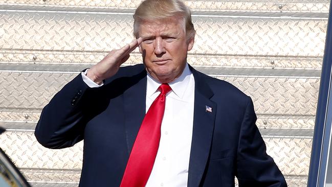 Donald Trump disembarks from Air Force One. Pic: AP