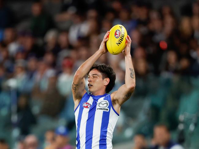 Zac Fisher of the Kangaroos marks the ball during the 2024 AFL Round 2 match between the North Melbourne Kangaroos and the Fremantle Dockers. (Photo by Dylan Burns/AFL Photos via Getty Images)