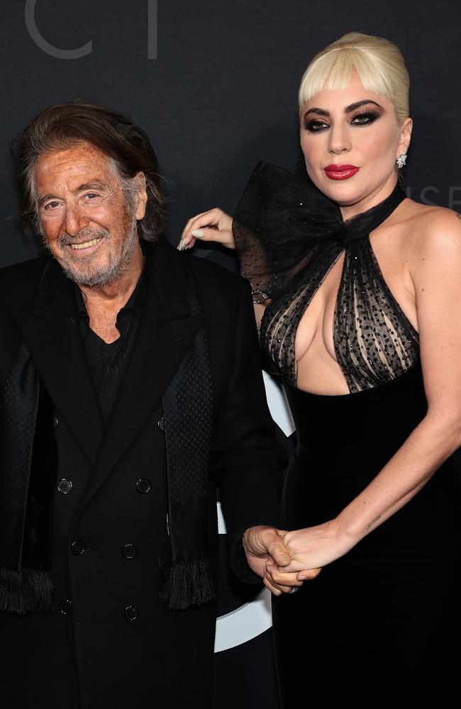 Bad Romance hitmaker Gaga clung to Pacino as they walked the carpet.