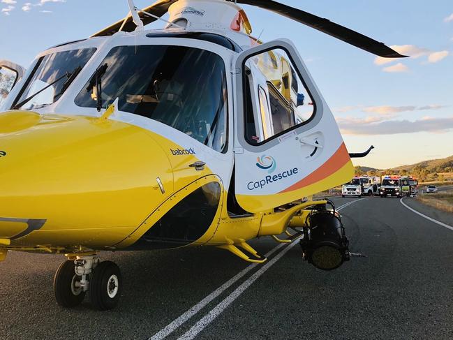 A rescue helicopter has been sent to a serious two-vehicle crash which has shut a Queensland highway with emergency crews fighting to free a patient trapped in the wreckage. Picture: CapRescue