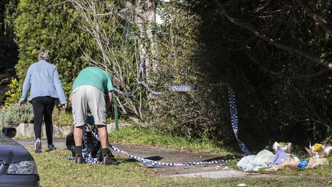 Police tape is removed from the house. Picture: Jenny Evans