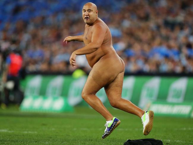 SYDNEY, AUSTRALIA - JULY 17:  (EDITORS NOTE: Image contains nudity.) A streaker runs onto the field in the final minutes during game three of the ARL State of Origin series between the New South Wales Blues and the Queensland Maroons at ANZ Stadium on July 17, 2013 in Sydney, Australia.  (Photo by Matt King/Getty Images)