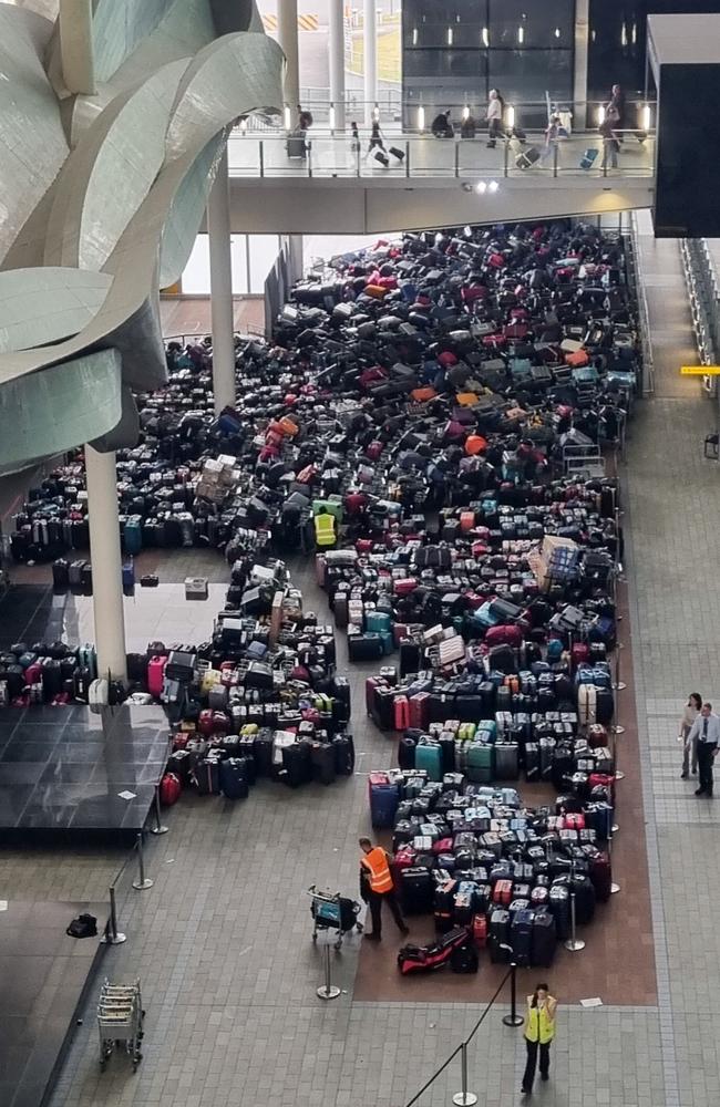 A ‘carpet of luggage’ built up at Heathrow after a baggage system glitch on Friday. Picture: HowesImages/Splash News/Media Mode