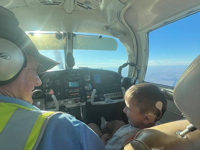 A volunteer pilot and a kid on their way to receive treatment. Photo: Angel Flight Australia.