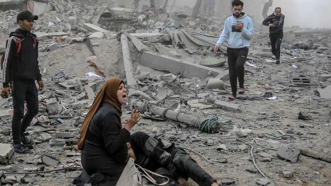 A Palestinian woman cradles a wounded boy after Israeli bombardment in central Gaza City. Picture: AFP