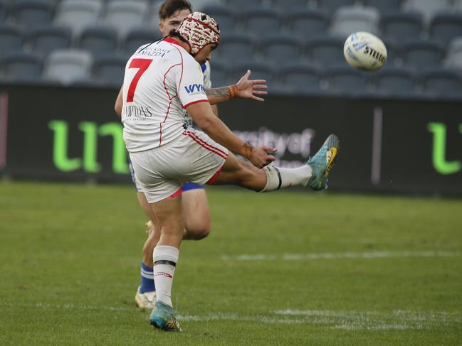 Dragons half Brandon Tikinau puts boot to ball. Picture: Warren Gannon Photography