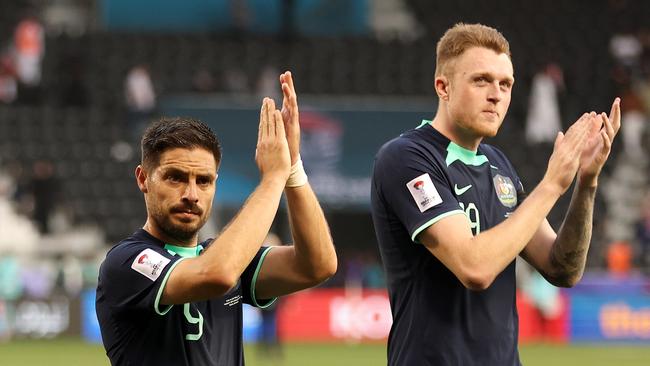 Bruno Fornaroli and Harry Souttar of Australia applaud Socceroos fans after the team's victory in the AFC Asian Cup Group B match over Syria. Picture: Robert Cianflone/Getty Images.