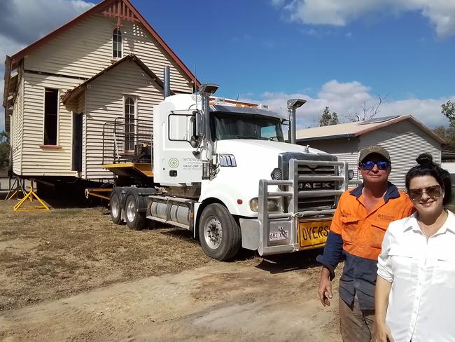 Jo Veneman and Kevin Nolan of Renewable Homes in front of the old St Andrew's church they relocated from Hughenden to their storage yard in Roseneath, Townsville.