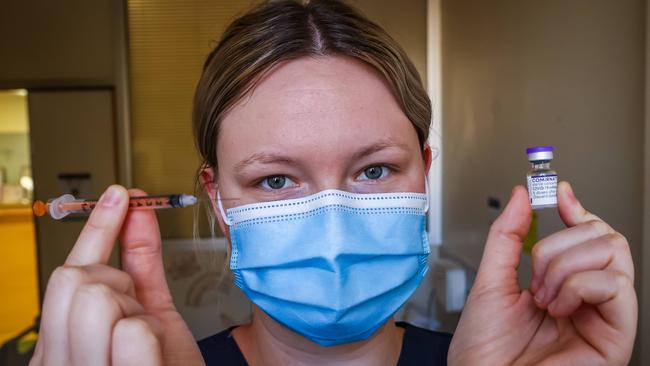 Immunisation nurse Charly Betzold with a vial of Pfizer at the Women and Children's Hospital on Monday. Picture: Tom Huntley