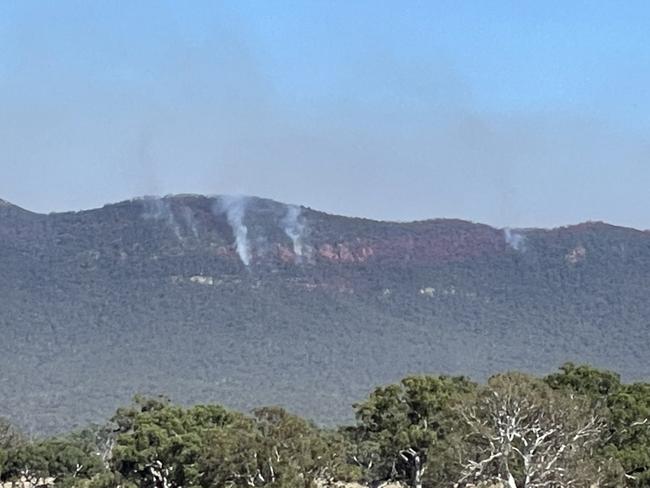 Smoke rises near Mirranatwa on Thursday morning.