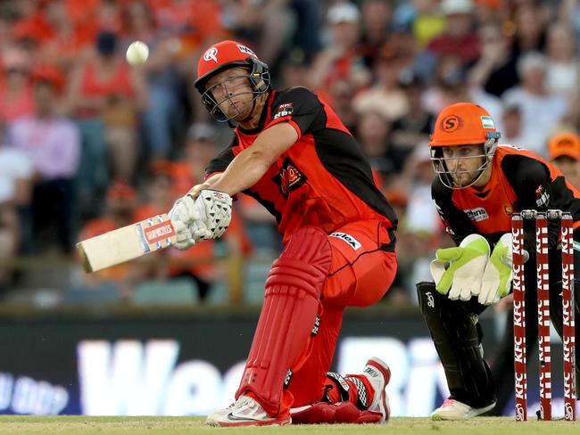 Cameron White lashes out against the Perth Scorchers on Monday. Picture: AP