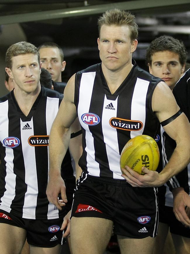 Buckley leads teammates in a Collingwood vs Geelong preliminary final match at the MCG in 2007.