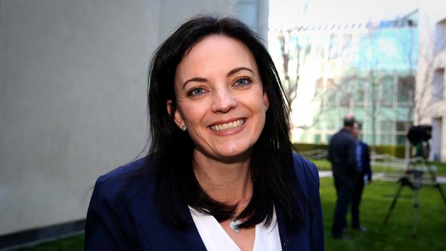 New MP Emma Husar mingles with other newly-elected members in a Parliament House courtyard in Canberra.