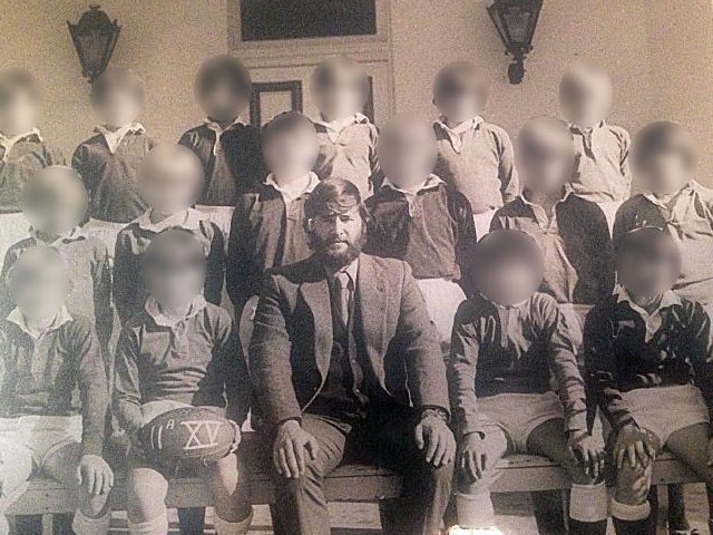 Disgraced former Trinity Grammar teacher Neil Futcher pictured with students in 1974.