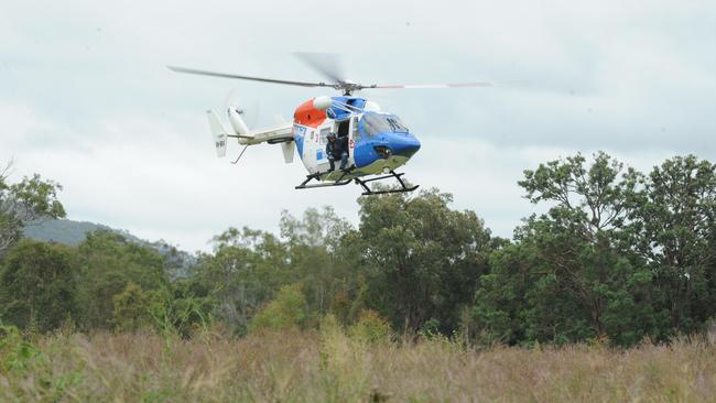 The AGL rescue helicopter lifts off for a sweep of the surrounding bushland in the search for missing motorcyclist Paul Stevenson. Photo: File