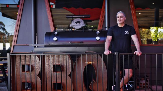 Restaurant owner Mehdi Moaddab with the barbecue smoker. Picture: Sam Ruttyn