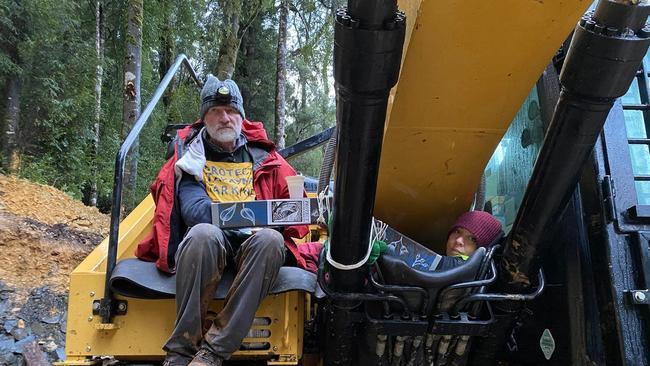 Protesters John Barrenger and Kristy Algar in the forest near Rosebery