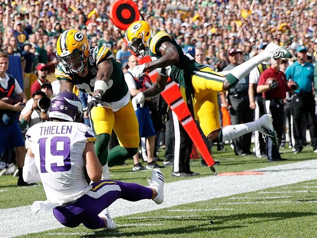 Adam Thielen #19 of the Minnesota Vikings catches a pass for a touchdown in front of Jaire Alexander #23 of the Green Bay Packers and Kentrell Brice #29 during the fourth quarter of a game at Lambeau Field. Picture: Getty Images