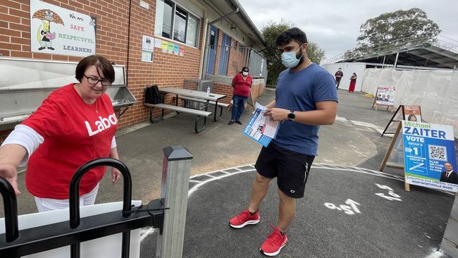 Lisa Lake speaks to voter Dharmendra Solanki at Wentworthville Public School.