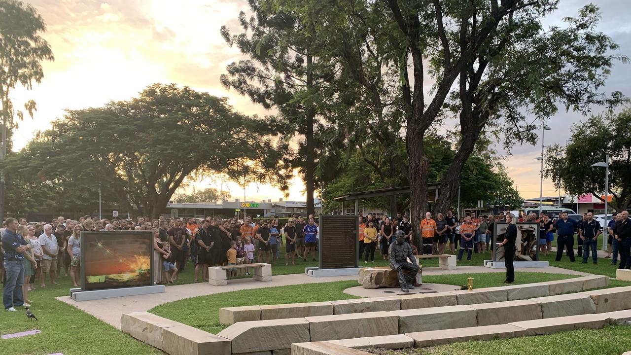 Councillor Kelly Vea Vea (standing right) speaks to the gathered crowd at the Moranbah Miners' Memorial before marking one minute's silence in memory of Moranbah North miner Gavin Feltwell. Picture: Duncan Evans