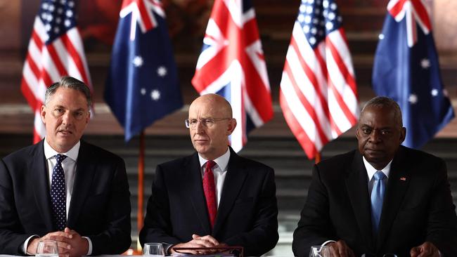 Defence Minister Richard Marles, Britain's Defence Secretary John Healey and former US defence secretary Lloyd Austin talk AUKUS. Picture: AFP