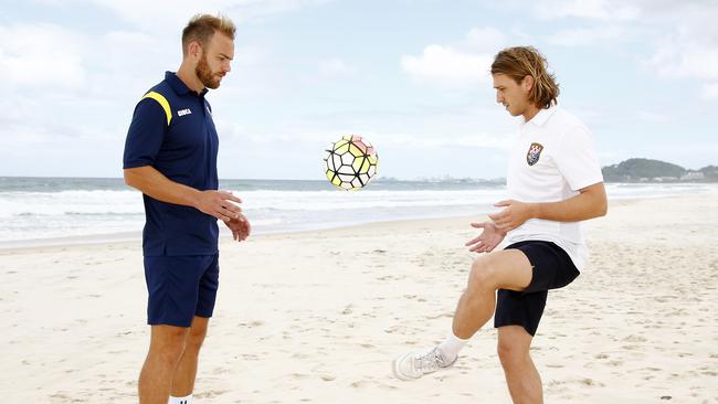 Gold Coast Knights player Max Brown (white shirt) and Gold Coast United player Justyn Mckay (blue shirt) get ready for the new season. Picture: Tertius Pickard