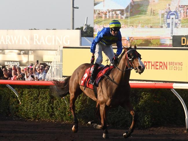 Jarrod Todd rides Playoffs over the finish line to win the Darwin Cup 2022. Picture: (A)manda Parkinson