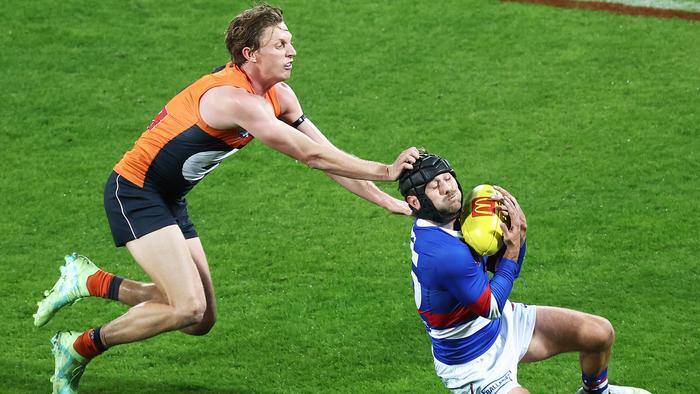 CANBERRA, AUSTRALIA - MAY 06:  Caleb Daniel of the Bulldogs is challenged by Lachie Whitfield of the Giants during the round eight AFL match between Greater Western Sydney Giants and Western Bulldogs at Manuka Oval, on May 06, 2023, in Canberra, Australia. (Photo by Matt King/AFL Photos/via Getty Images )