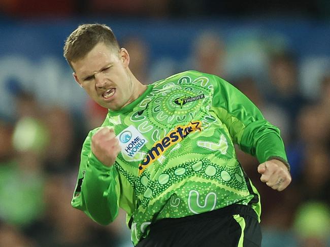 CANBERRA, AUSTRALIA - DECEMBER 17: Lockie Ferguson of the Thunder celebrates taking the wicket of James Bazley of the Strikers during the BBL match between Sydney Thunder and Adelaide Strikers at Manuka Oval, on December 17, 2024, in Canberra, Australia. (Photo by Mark Metcalfe/Getty Images)